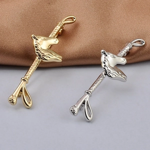 Detail of horse head lapel pins in gold and silver finish with equestrian design