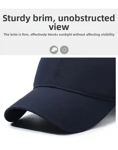 Close-up of firm sun visor brim with reinforced stitching on breathable mesh navy cap