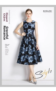 Detail of elegant black sleeveless jacquard dress with large blue floral pattern and slim waist