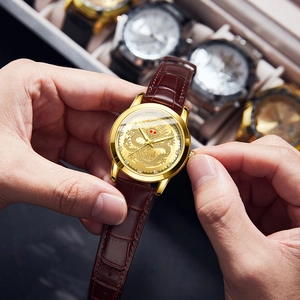Classic men's quartz watch with a detailed golden dragon dial and brown leather strap