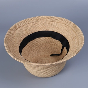Elegant hand-woven raffia straw bucket hat with inner adjustable strap for women