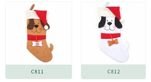 Detail of Christmas dog stockings in brown and white with plush ears and bone charms