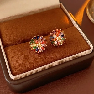 Colorful zircon flower stud earrings in gold plating displayed in a premium jewelry box