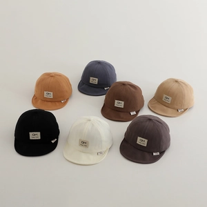Detail view of 7 color options for soft-brim baby baseball caps in premium cotton