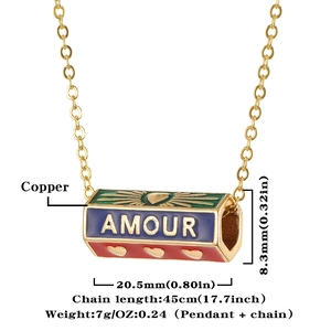 Detail view of colorful enamel pendant necklace with Amour text and heart patterns