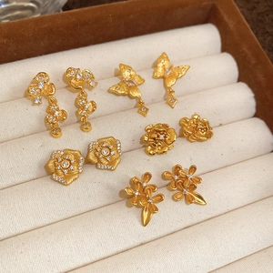 Detailed collection of 24K gold plated flower and butterfly stud earrings with zircons