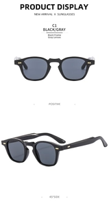 Vista frontale e laterale a 45 gradi degli occhiali da sole neri con rivetti dorati