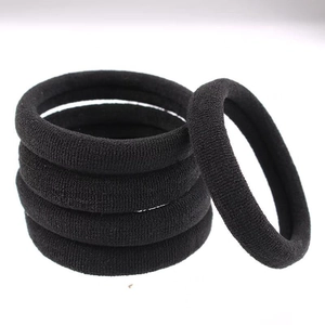 Macro shot of seamless black elastic hair bands with premium knit texture