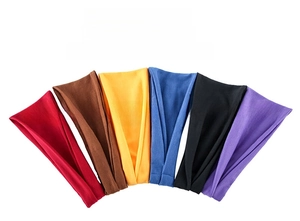 Macro view of elastic sweat-wicking yoga headbands in diverse vibrant colors