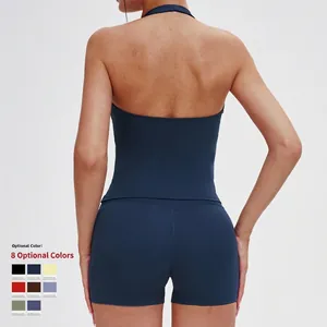 Women's backless navy blue yoga set with halter top and high-waisted gym shorts