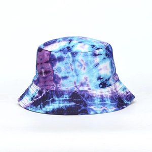 Detail of blue and purple tie-dye bucket hat showing reinforced stitching and canvas texture