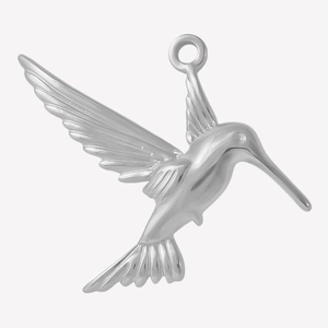 Macro detail of bird pendant featuring polished stainless steel wings and tail texture