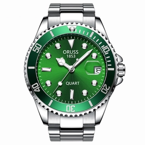Close-up of green dial and steel bezel on business watch with date display function