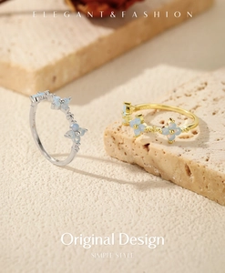 Macro view of S925 sterling silver clover rings with opal inlay in silver and gold finish