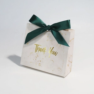 Elegant marble pattern gift bag with Thank You gold foil text and green satin bow ribbon