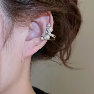 Elegant silver ear bone clip featuring five white pearls and sparkling cubic zirconia accents