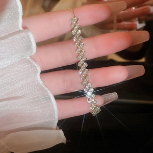 Close-up of sparkling adjustable silver bracelet with multi-row zirconia in S-curve design