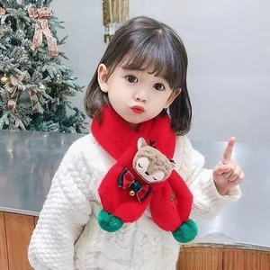 Detailed view of kids red plush Christmas scarf with cute deer cartoon and green pompom