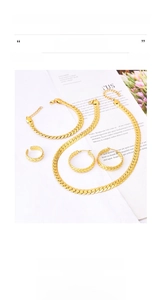 Close-up of golden titanium steel twist chain jewelry set with woven texture