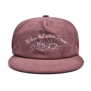 Close-up of white cactus embroidery and text on vintage pink corduroy flat brim hat