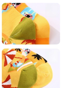 Detailed macro view of reinforced toe and 3D heel on yellow tropical beach socks