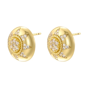 Luxurious gold dome earrings with sunburst pattern and sparkling zircon stones on white base