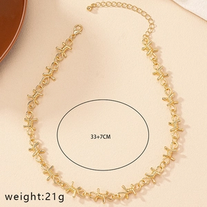 Detailed shot of golden thorn style necklace showing 33+7CM length and 21g weight