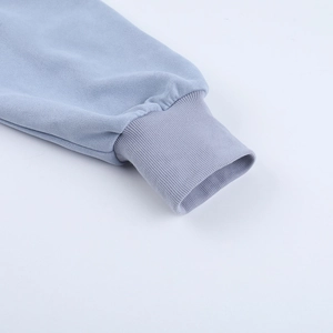 Close-up of light blue ribbed cuffs on long-sleeve casual polo jacket fabric