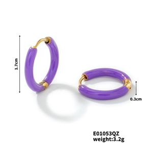 Detail view of purple enamel gold hoops with 1.7cm diameter and 0.3cm width