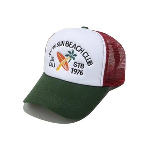 Close-up of retro trucker hat featuring beach club embroidery and breathable mesh detail
