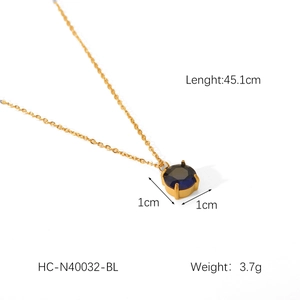Detail view of a 45.1cm gold stainless steel chain with a 1cm blue round pendant