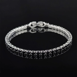 Macro view of silver tennis bracelet with black cubic zirconia and secure double clasp