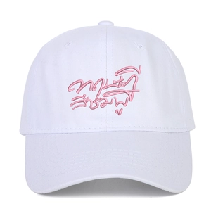 White washed cotton baseball cap featuring pink Thai script embroidery on the front