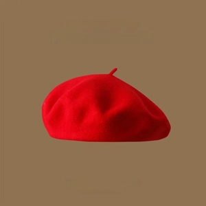 Close-up detail of the premium red wool felt texture on this vintage beret hat for women