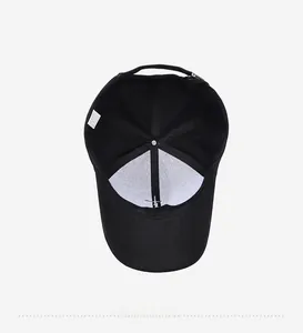 Detail view of the black baseball cap interior with reinforced seams and polyester lining
