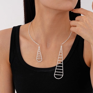 Silver open choker with sparkling rhinestones and geometric droplet tassels on model