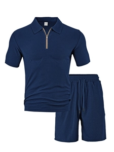Detail of navy polo set showing textured honeycomb knit fabric and zipper collar