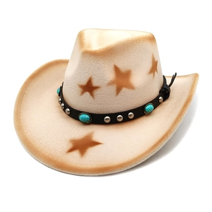 Detail of beige cowboy hat featuring brown star prints and turquoise rivet hatband