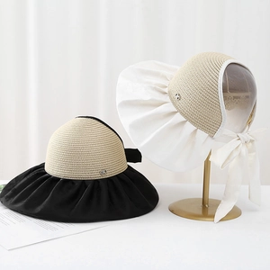 Women's wide brim sun hat with elegant bow and straw weaving in black and cream