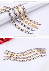 Close-up of polished titanium steel bracelets with cubic zirconia in four metallic colors