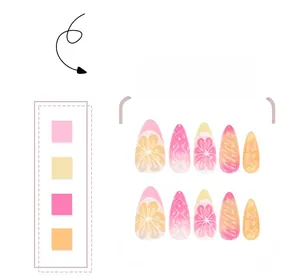 Vue macro de motifs 3D citron et orange sur des faux ongles français dégradés