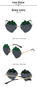Three-angle views of strawberry-shaped sunglasses with gray lenses and gold frames