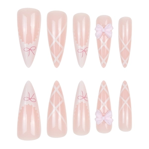 Pink ballet style press-on nails with 3D resin bows and elegant white cross patterns