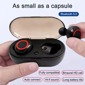 Detailed view of TWS wireless earbuds in hand showing charging case and ergonomic design