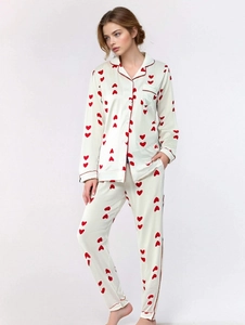 Full view of women's waffle knit pajama set with red heart pattern and soft fabric