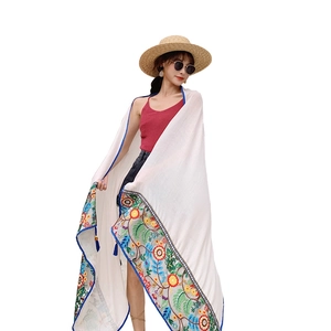 Bohemian white cotton linen shawl with colorful floral embroidery and blue tassels