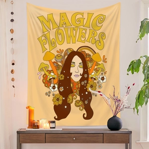 Detail of bohemian tapestry featuring magic flowers and vintage mushroom illustration