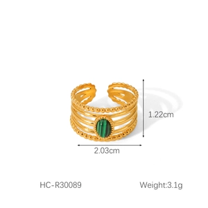 Detail view of multi-layer gold stainless steel ring with green malachite stone inlay