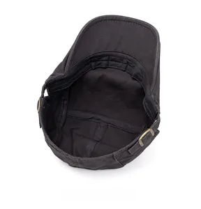 Internal view of washed cotton flat cap with neat stitching and adjustable metal buckle