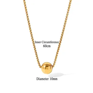 Minimalist 18K gold ball pendant necklace with adjustable chain shown in white background
